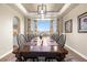 Formal dining room featuring a large wooden table and picturesque bay window view at 286 Claymoor Ct, Castle Pines, CO 80108