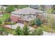 A well maintained home with a three-car garage, mature trees, and manicured landscaping at 286 Claymoor Ct, Castle Pines, CO 80108