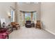 Sitting room with ample windows, patterned curtains, neutral walls, and comfortable seating at 286 Claymoor Ct, Castle Pines, CO 80108