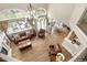 An aerial view shows the bright living room, fireplace, patio, and open-concept floor plan at 286 Claymoor Ct, Castle Pines, CO 80108