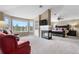 Spacious main bedroom featuring a fireplace, sitting area with large windows, and a stylish four-poster bed at 286 Claymoor Ct, Castle Pines, CO 80108
