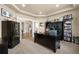 The home office is furnished with a desk, bookshelves, and a safe for secure document storage at 286 Claymoor Ct, Castle Pines, CO 80108