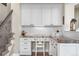 The office nook includes white cabinets, drawers, granite countertops, and a comfortable chair at 286 Claymoor Ct, Castle Pines, CO 80108