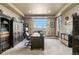 Home office with tray ceiling, a large desk, storage solutions, and natural light at 286 Claymoor Ct, Castle Pines, CO 80108