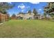 Expansive backyard with a large lawn, mature trees, and well-maintained fencing, offering privacy and space at 12671 W Dakota Dr, Lakewood, CO 80228