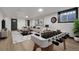 Finished basement features carpet, window, modern lighting, and foosball table at 12671 W Dakota Dr, Lakewood, CO 80228