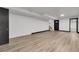 Spacious finished basement with ample lighting and vinyl plank flooring at 12671 W Dakota Dr, Lakewood, CO 80228