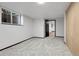 Finished basement features neutral carpet, a window and large closet at 12671 W Dakota Dr, Lakewood, CO 80228