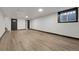 Finished basement has wood flooring, a window and recessed lighting at 12671 W Dakota Dr, Lakewood, CO 80228