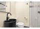 Bathroom features a modern sink, toilet, shower, and decorative tiles at 12671 W Dakota Dr, Lakewood, CO 80228