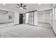 Bright bedroom featuring closet with sliding doors and a ceiling fan at 12671 W Dakota Dr, Lakewood, CO 80228