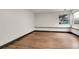 Bedroom featuring hardwood flooring, large window and dark trim at 12671 W Dakota Dr, Lakewood, CO 80228