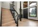Inviting foyer showcasing a staircase and black framed windows and entry door at 12671 W Dakota Dr, Lakewood, CO 80228