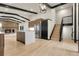 Open kitchen with sleek island and stainless steel appliances at 12671 W Dakota Dr, Lakewood, CO 80228