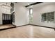 Bright and spacious living room boasts large windows and hardwood floors at 12671 W Dakota Dr, Lakewood, CO 80228