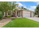 Beautiful brick home featuring a three-car garage and well-manicured lawn at 12714 Kalamath Ct, Westminster, CO 80234