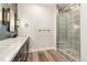 Bathroom showcasing patterned glass shower, modern vanity and gray subway tiles at 5165 Vivian St, Wheat Ridge, CO 80033