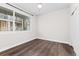 Bedroom featuring vinyl floors, a closet, and a window for natural light at 5165 Vivian St, Wheat Ridge, CO 80033