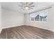 Bright and airy bedroom with ceiling fan and large window at 5165 Vivian St, Wheat Ridge, CO 80033