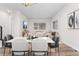 The dining room features modern furnishings, great natural light and plenty of space at 5165 Vivian St, Wheat Ridge, CO 80033