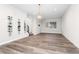 Spacious living room with modern light fixture and wine rack at 5165 Vivian St, Wheat Ridge, CO 80033