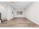 Open living room area with large window providing natural light at 5165 Vivian St, Wheat Ridge, CO 80033