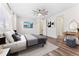 This main bedroom features natural light, an ensuite bathroom, and a ceiling fan at 5165 Vivian St, Wheat Ridge, CO 80033