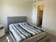 Bright bedroom featuring carpet and an open closet door at 8657 Clay St # 383, Westminster, CO 80031