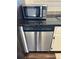 Stainless steel dishwasher, and microwave oven, complementing the kitchen's design at 8657 Clay St # 383, Westminster, CO 80031