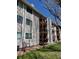Multi-story condo building with private wood balconies and neutral siding at 8657 Clay St # 383, Westminster, CO 80031