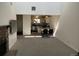 Open-concept living and dining area featuring a fireplace and vaulted ceilings at 8657 Clay St # 383, Westminster, CO 80031