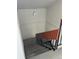 View of stairs with metal railing, painted white walls and concrete steps leading downward in a stairwell at 8657 Clay St # 383, Westminster, CO 80031