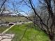 Bright view from a window featuring trees and a grassy area on a sunny day at 8657 Clay St # 383, Westminster, CO 80031