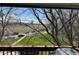 Scenic view from a balcony showcasing a green field, nearby street, and distant water tower on a clear day at 8657 Clay St # 383, Westminster, CO 80031