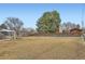 Large, expansive backyard with mature trees, shed, and plenty of open space at 8097 E Lehigh Dr, Denver, CO 80237