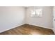 Bedroom featuring hardwood flooring, baseboard, and natural light at 8097 E Lehigh Dr, Denver, CO 80237