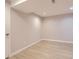 A clean, bright bedroom with modern flooring, fresh paint, and a neutral color palette at 8097 E Lehigh Dr, Denver, CO 80237