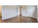 Spacious bedroom featuring refinished hardwood flooring and neutral paint at 8097 E Lehigh Dr, Denver, CO 80237