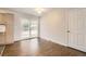 Dining room with sliding glass door to back yard and refinished hardwood floors at 8097 E Lehigh Dr, Denver, CO 80237