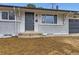 Charming single-story home with a brick facade and well-maintained front door at 8097 E Lehigh Dr, Denver, CO 80237