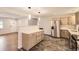 Open kitchen features stainless steel appliances, stylish countertops, and ample cabinet space at 8097 E Lehigh Dr, Denver, CO 80237