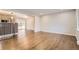 Spacious living room with beautiful hardwood floors and an open concept design at 8097 E Lehigh Dr, Denver, CO 80237