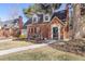 Beautiful two-story brick home with a charming front yard, well-maintained landscaping, and a cozy front porch at 700 Holly St, Denver, CO 80220