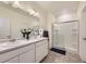 Clean bathroom with double sinks, spacious walk-in shower, and modern fixtures at 45871 Orchid Ave, Bennett, CO 80102
