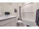 Neat bathroom featuring a vanity with a sink, toilet, and a shower and bathtub combination at 45871 Orchid Ave, Bennett, CO 80102