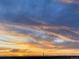 Scenic sky view featuring a colorful sunrise with orange and purple colors at 45871 Orchid Ave, Bennett, CO 80102