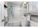 Clean bathroom with white vanity, tub shower, and updated fixtures at 1157 Krameria St, Denver, CO 80220