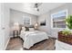 Bright bedroom featuring a comfortable bed and hardwood floors at 1157 Krameria St, Denver, CO 80220