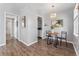 Eat-in kitchen and dining area with hardwood floors at 1157 Krameria St, Denver, CO 80220