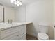 Well-lit bathroom with white vanity, stylish sink, and modern fixtures at 4896 S Dudley St # 8, Littleton, CO 80123